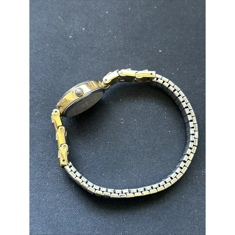 Gold Tone Oval Case Women’s Stretch Band Quartz Watch